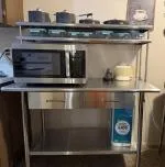 Size of bars that attach 2 shelves are 21 inches and second shelf is adjustable, but not sure I would put anything heavy on second shelf.  5